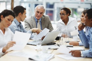 Rc327ff1350b552b125e330bf27a5d2b6 Business people discussing work on laptop at a meeting